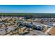 Aerial shot of the community with clubhouse, pool, tennis courts, ponds, and residences at 106 Sea Lavender Ln, Summerville, SC 29486