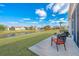 This outdoor patio features comfortable seating and scenic views of the pond at 106 Sea Lavender Ln, Summerville, SC 29486