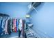 Walk-in closet, featuring ample hanging space and shelving for organized storage with blue walls at 106 Sea Lavender Ln, Summerville, SC 29486