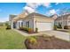 Charming single-Gathering home with well-manicured landscaping, two-car garage and neutral-colored exterior at 106 Sea Lavender Ln, Summerville, SC 29486