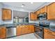 Well-equipped kitchen featuring stainless steel appliances, granite countertops, and light wood cabinetry at 106 Sea Lavender Ln, Summerville, SC 29486