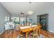 Inviting living room featuring a dining table, bright windows and glass doors to access the porch at 106 Sea Lavender Ln, Summerville, SC 29486