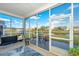 Screened patio with scenic water view, swing, and seating, perfect for relaxing and enjoying the outdoors at 106 Sea Lavender Ln, Summerville, SC 29486