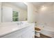 Bright bathroom featuring a white vanity, bath tub and new fixtures at 107 Ranworth Ln, Summerville, SC 29485