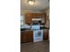 Well-lit kitchen featuring essential appliances, ample counter space, and wooden cabinets at 107 Ranworth Ln, Summerville, SC 29485