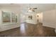 Spacious living room featuring hardwood floors, a ceiling fan and plenty of natural light at 107 Ranworth Ln, Summerville, SC 29485