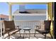 Relaxing balcony view featuring cushioned chairs and a glass-topped table at 108 Smith St # 108-C, Charleston, SC 29403
