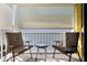 Relaxing balcony view featuring cushioned chairs and a glass-topped table at 108 Smith St # 108-C, Charleston, SC 29403