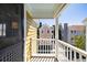 Charming balcony with white railing, view of a neighboring home, and blue sky at 108 Smith St # 108-C, Charleston, SC 29403