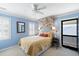 Charming bedroom featuring blue walls, white trim and carpet, and a comfortable queen bed at 108 Smith St # 108-C, Charleston, SC 29403