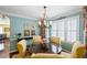 Inviting dining area with a round table, complemented by window views, and stylish decor at 108 Smith St # 108-C, Charleston, SC 29403