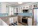 Kitchen showcasing granite countertops, stainless steel appliances, a wine rack, and white shaker cabinets at 108 Smith St # 108-C, Charleston, SC 29403