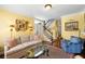 Cozy living room showcasing hardwood floors, neutral walls, and decorative wall art at 108 Smith St # 108-C, Charleston, SC 29403