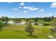 Picturesque aerial view of the community, showcasing the pond, lush lawns, and mature trees at 110 Dunbury Dr, Summerville, SC 29485