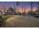 Spacious backyard with a play set and a large grassy area, perfect for Gathering activities and recreation at 110 Dunbury Dr, Summerville, SC 29485