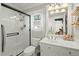 Bright bathroom featuring a glass enclosed shower, white tile, and sink with vanity at 110 Dunbury Dr, Summerville, SC 29485