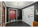 Stylish foyer with tile flooring, dark walls, and convenient bench with storage at 110 Dunbury Dr, Summerville, SC 29485