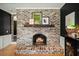 A classic whitewashed brick fireplace with an arched opening adds charm to this beautiful home at 110 Dunbury Dr, Summerville, SC 29485