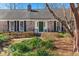 Close-up of a charming brick home featuring a green front door with detailed trim at 110 Dunbury Dr, Summerville, SC 29485