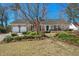 Charming brick home with attached garage, lush lawn, and beautifully landscaped garden at 110 Dunbury Dr, Summerville, SC 29485