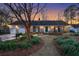 Charming brick home with a well-manicured front yard and inviting green front door at 110 Dunbury Dr, Summerville, SC 29485