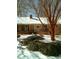 Charming brick ranch-style home featuring snowy roof, winter landscaping, and festive front door wreath at 110 Dunbury Dr, Summerville, SC 29485