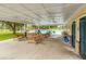 Covered poolside pavilion with picnic tables, ceiling fans, and ample space for gatherings at 110 Dunbury Dr, Summerville, SC 29485