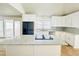 Bright kitchen with granite countertops, stainless steel appliances, and breakfast bar seating at 112 Mansfield Blvd, North Charleston, SC 29418