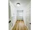 Bright laundry room featuring modern light fixtures, white cabinets, and light wood flooring for a clean and functional space at 112 Mansfield Blvd, North Charleston, SC 29418