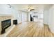 Open-concept area with fireplace, sliding doors, and modern kitchen with black appliances at 112 Mansfield Blvd, North Charleston, SC 29418