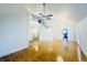 Bright open living room with hardwood floors, cathedral ceiling, staircase access, and modern light fixtures at 112 Mansfield Blvd, North Charleston, SC 29418