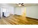 Open-concept space featuring hardwood floors, seamlessly connecting the living area to the kitchen at 112 Mansfield Blvd, North Charleston, SC 29418