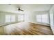Living room with large windows, ceiling fan and wood-look flooring at 112 Mansfield Blvd, North Charleston, SC 29418