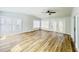 Bright living room featuring a ceiling fan, and lots of natural light from many windows at 112 Mansfield Blvd, North Charleston, SC 29418