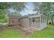Exterior view of a screened-in porch with siding and brick accents at 112 Pine Grove Dr, North Charleston, SC 29420