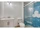Modern bathroom featuring a shower with striking blue geometric tiles and a white vanity at 112 Pine Grove Dr, North Charleston, SC 29420