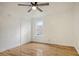 Comfortable bedroom with hardwood floors, double closets, a ceiling fan and a window at 112 Pine Grove Dr, North Charleston, SC 29420