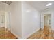 Hallway with wood floors and bright white walls and doors at 112 Pine Grove Dr, North Charleston, SC 29420