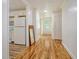 Hallway leading to kitchen and front door with hardwood floors at 112 Pine Grove Dr, North Charleston, SC 29420