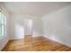 Bright living room with hardwood floors, white walls, and arched doorway at 112 Pine Grove Dr, North Charleston, SC 29420