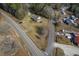 Bird's eye view of a well-maintained property with a home, outbuildings, and paved roads nearby at 1186 French Santee Rd, Jamestown, SC 29453
