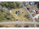 Overhead shot of a home with a large yard, adjacent to a quiet road and lush greenery at 1186 French Santee Rd, Jamestown, SC 29453