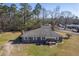 Aerial view of the brick home showing the roof, large lot, and surrounding trees at 1186 French Santee Rd, Jamestown, SC 29453