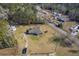 Aerial view of home and property featuring a well-maintained lawn, driveway, and a parked vehicle at 1186 French Santee Rd, Jamestown, SC 29453