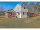 Backyard view of the house featuring brick and vinyl siding and a grassy lawn at 1186 French Santee Rd, Jamestown, SC 29453