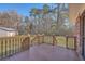 Spacious backyard with a wooden deck, grassy lawn, and a storage shed at 1186 French Santee Rd, Jamestown, SC 29453