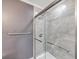 Modern bathroom featuring glass shower with beautiful marble style tile at 1186 French Santee Rd, Jamestown, SC 29453