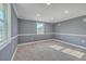 Bright bedroom with gray walls, neutral carpet, white trim, and natural light from two windows at 1186 French Santee Rd, Jamestown, SC 29453