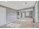 Empty bedroom with neutral walls, new carpeting, trim work, recessed lights, and ample sunlight from the windows at 1186 French Santee Rd, Jamestown, SC 29453