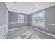 Empty bedroom with neutral carpet, gray walls, and two windows at 1186 French Santee Rd, Jamestown, SC 29453